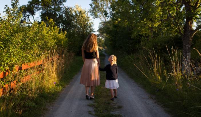 A mother and daughter walking and talking about why you should talk to your kids about alcohol
